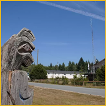 Wooden carved sculpture outdoors under blue sky