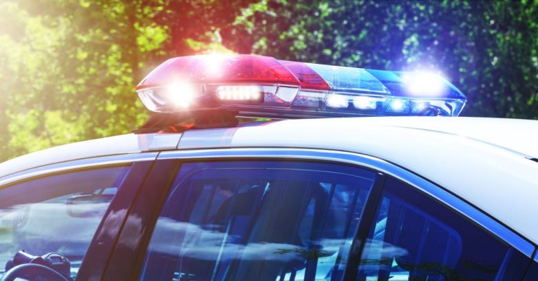 Police car with flashing red and blue lights