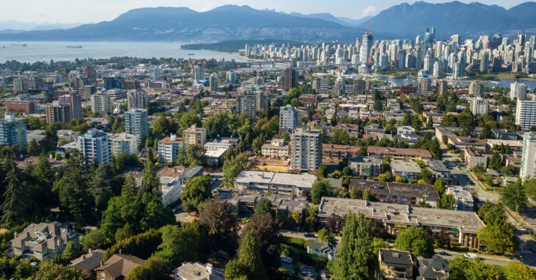 Aerial view of coastal city skyline and mountains