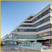 Modern stepped building with glass facade and Esplanade sign