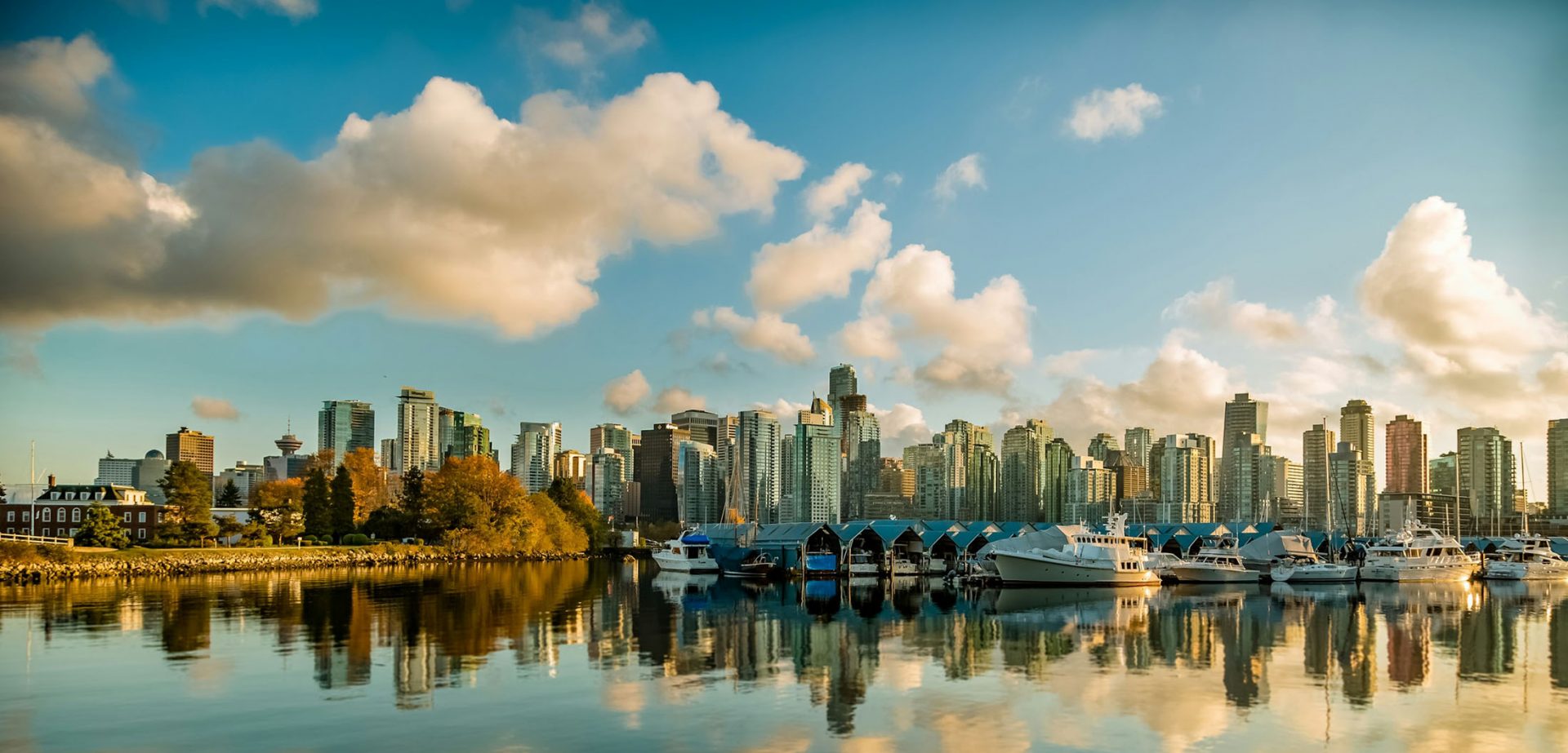 City skyline and marina at sunset reflection