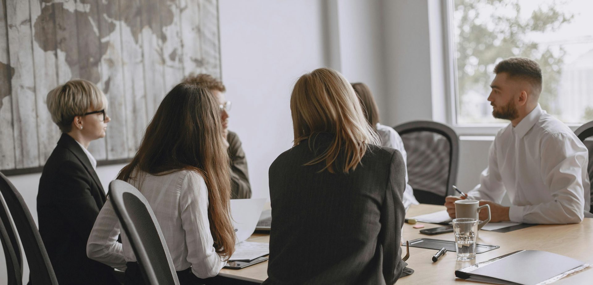 Business team meeting around conference table in office