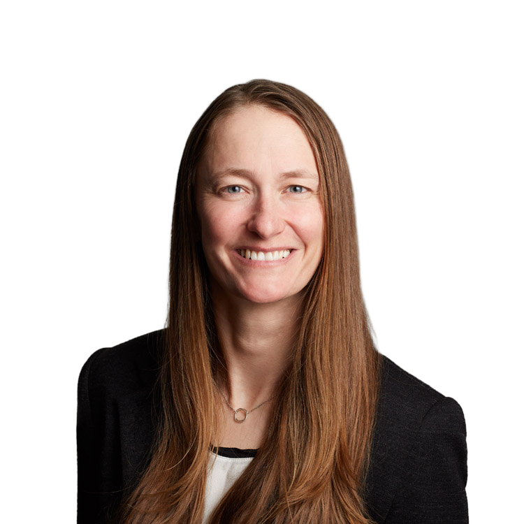Smiling woman with long brown hair in blazer