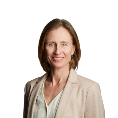 Professional headshot of smiling woman in beige blazer