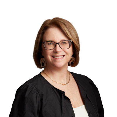 Smiling woman with glasses against neutral background