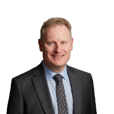 Smiling businessman in suit and tie headshot