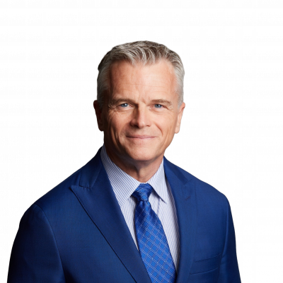 Smiling businessman in blue suit and tie headshot