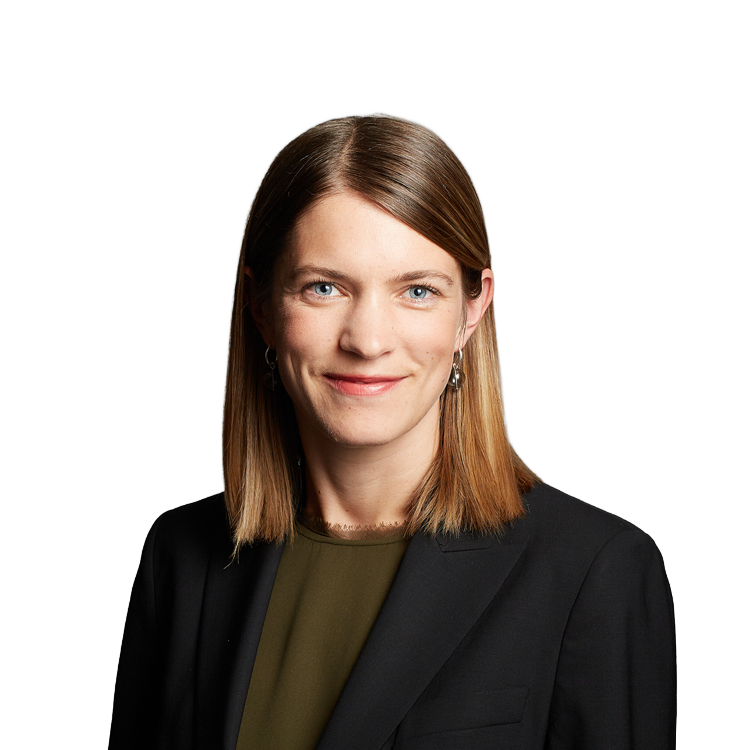 Professional headshot of woman in dark blazer
