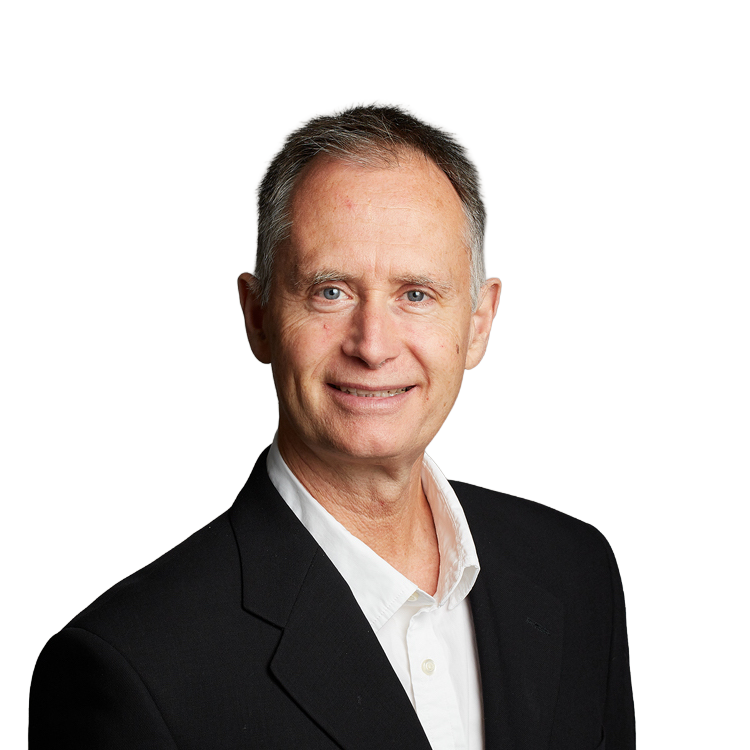 Smiling middle-aged man in suit against neutral background