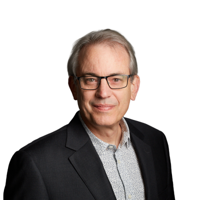 Portrait of older man wearing glasses and blazer