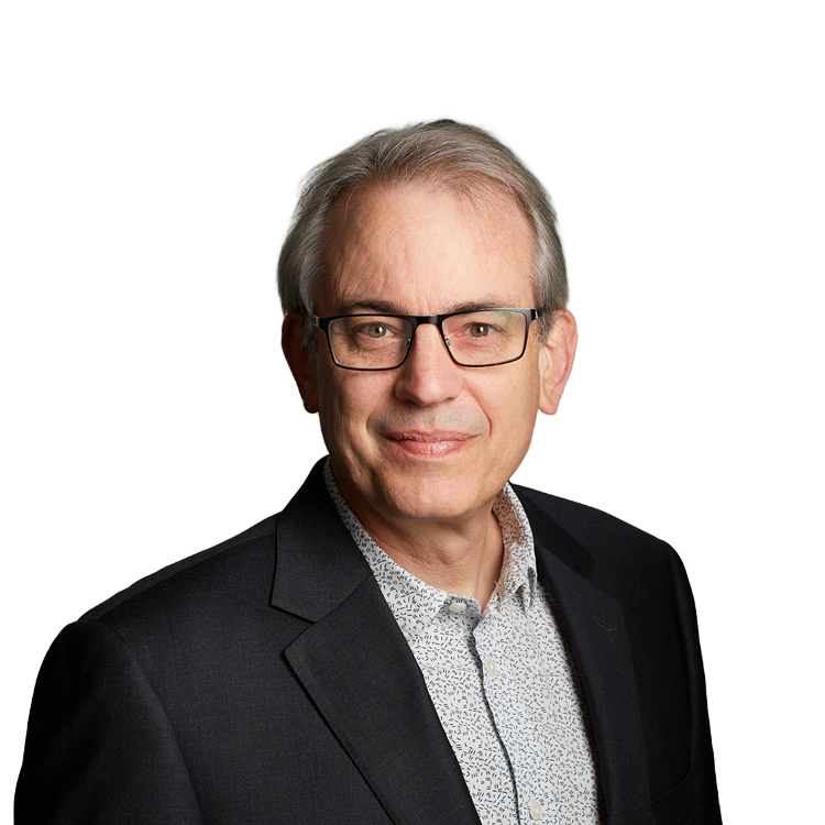 Portrait of older man wearing glasses and blazer