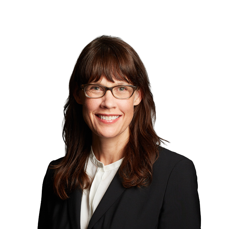Smiling professional woman wearing glasses and blazer