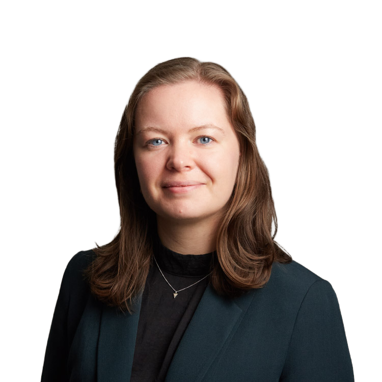 Professional headshot of woman in dark blazer